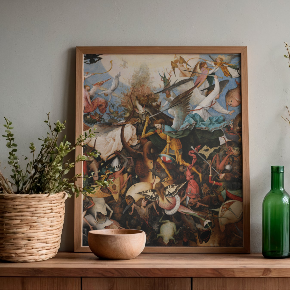 Pieter Bruegel The Fall of the Rebel Angels displayed in a wooden frame